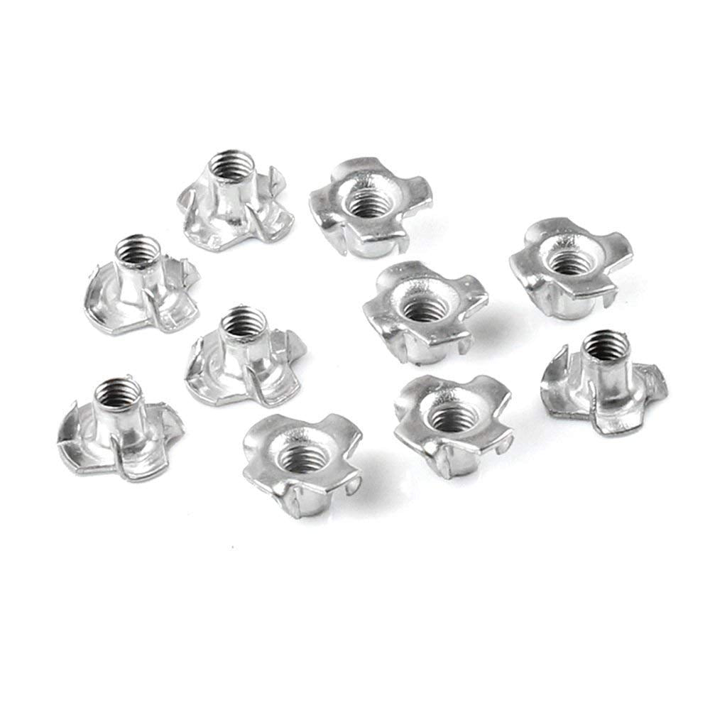 Metal T-nuts with prongs for secure furniture and wood bolt fastening.