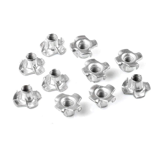 Metal T-nuts with prongs for secure furniture and wood bolt fastening.